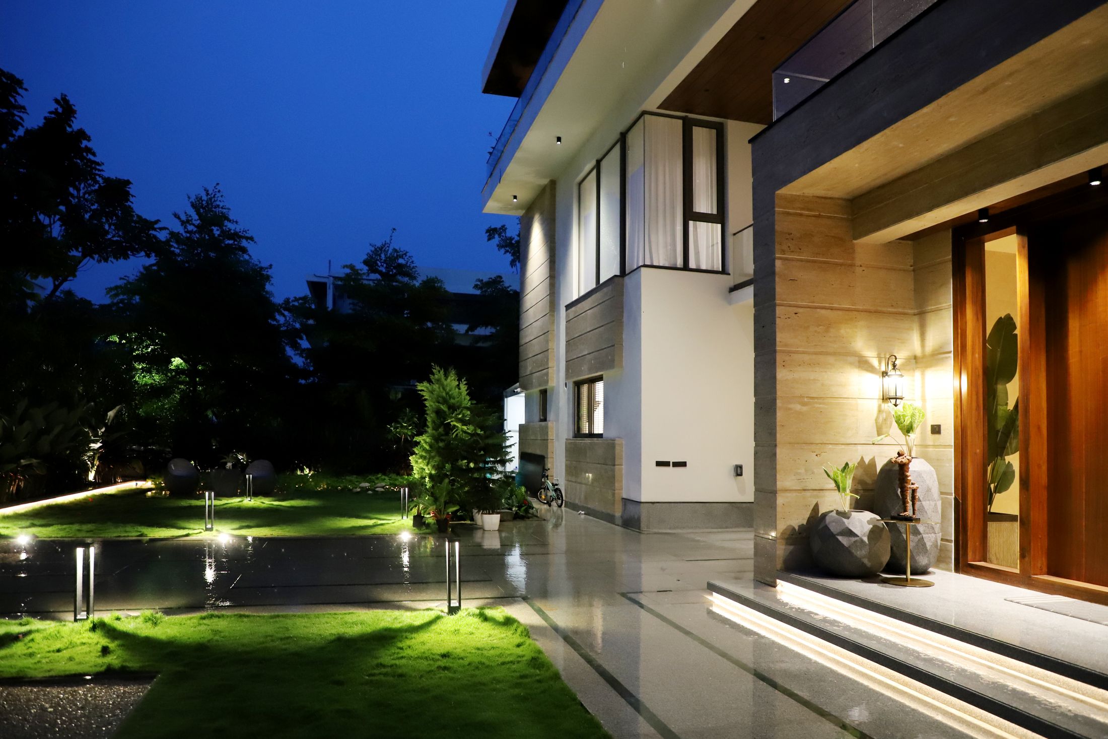Modern home exterior lit at dusk
